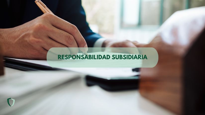 Responsabilidad subsidiaria Dos personas firmando un contrato donde se encuentra la cláusula de responsabilidad subsidiaria